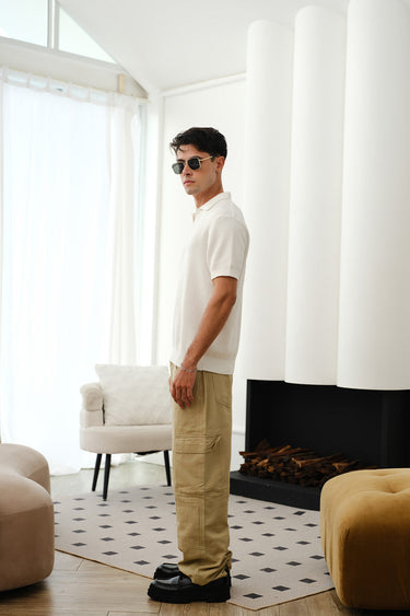 White knit polo T-shirt from Bonkers Corner with a classic collar and short sleeves, displayed on a plain background.
