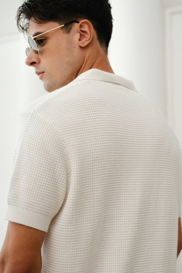 White knit polo T-shirt by Bonkers Corner, featuring a classic collar and short sleeves, displayed on a plain background.