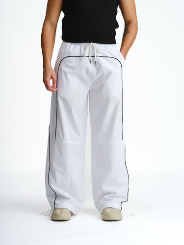 White sporty deconstructed loose pants by Bonkers Corner, relaxed fit with stylish casual design.