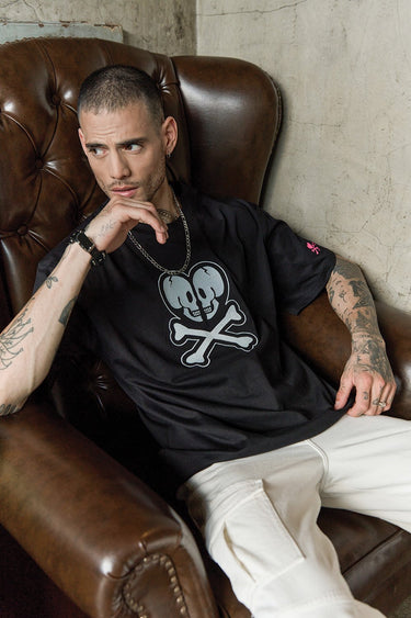 Bonkers Corner Heart of Skulls oversized T-shirt featuring a bold skull graphic design on soft fabric.