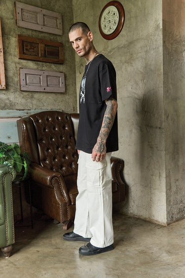 Bonkers Corner Heart Of Skulls oversized T-shirt featuring a bold skull print on soft fabric, casual streetwear style.