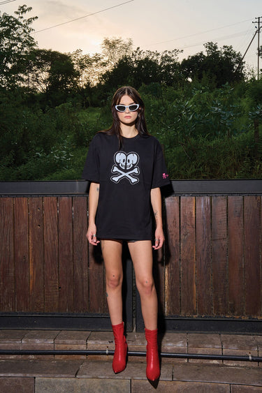 Black oversized T-shirt by Bonkers Corner featuring a bold Heart Of Skulls graphic on the front.