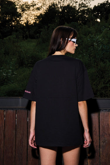 Bonkers Corner Heart of Skulls oversized T-shirt featuring a bold skull graphic on a black fabric background.