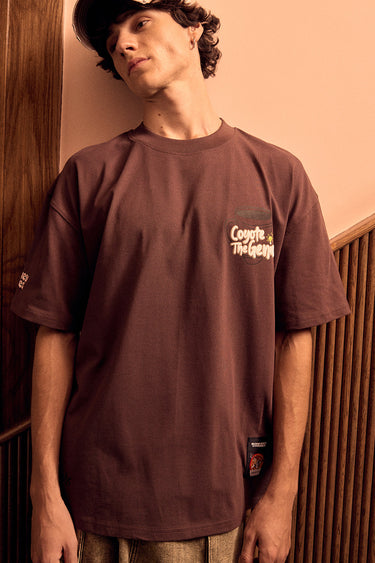 Bonkers Corner Coyote The Genius oversized T-shirt in XXS, featuring a bold graphic design on soft cotton fabric.