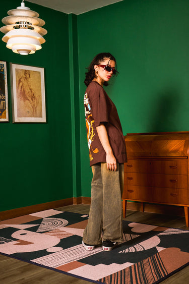 Bonkers Corner Coyote The Genius oversized T-shirt in XXS displayed flat with graphic design and soft fabric texture.