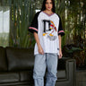 Donald Duck 34 oversized jersey by Bonkers Corner, showing a navy blue knit fabric with a large Donald Duck graphic on the front.
