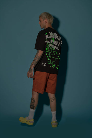 Oversized Bonkers Corner T-shirt with "Humans Aren't Real" printed slogan, in black, displayed on a plain background.