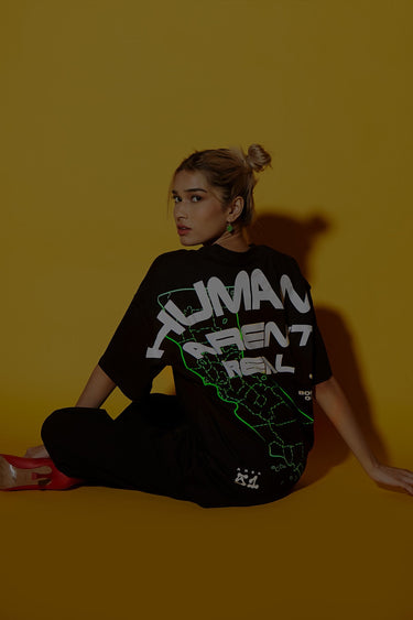Oversized Bonkers Corner "Humans Aren't Real" T-shirt in XXS, featuring bold printed design on soft fabric.