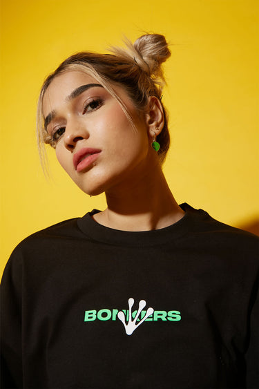 Bonkers Corner Humans Aren't Real oversized T-shirt in black, featuring bold white text and relaxed fit design.