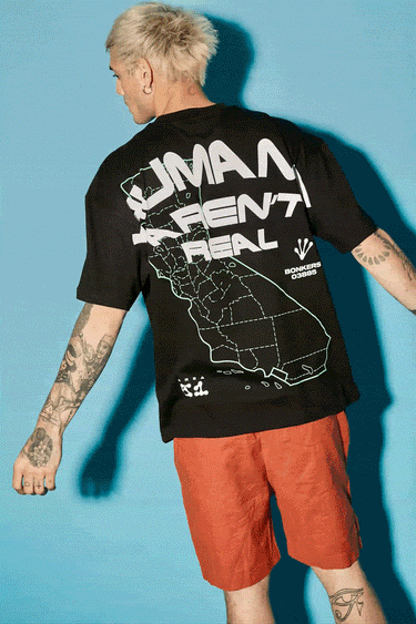 Bonkers Corner oversized T-shirt featuring bold "Humans Aren't Real" graphic in black and white, front view, casual fit.