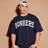 Navy blue oversized signature T-shirt by Bonkers Corner, featuring a relaxed fit and casual style on a mannequin.