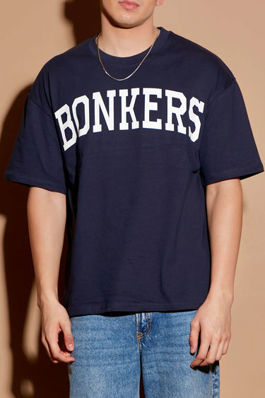 Navy blue oversized T-shirt by Bonkers Corner with signature logo print, relaxed fit, and casual streetwear style.