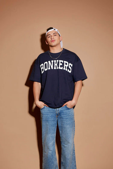 Navy blue oversized T-shirt by Bonkers Corner with signature logo design, shown on a plain background.