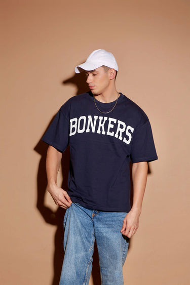Navy blue oversized T-shirt by Bonkers Corner with signature logo design, displayed flat on a white background.