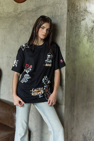 Bonkers Corner Tokidoki oversized T-shirt featuring colorful all-over print with playful character graphics.