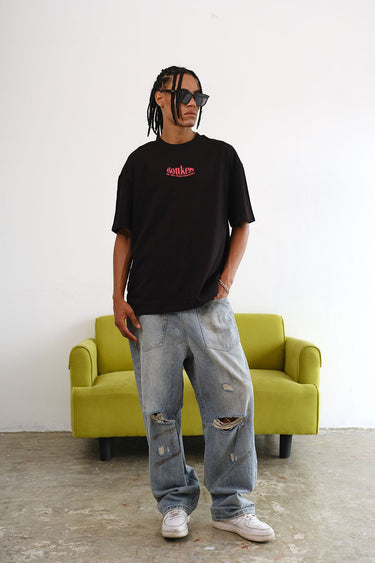 Black oversized T-shirt featuring main character graphic by BonkersCorner, casual fit, and comfortable design.