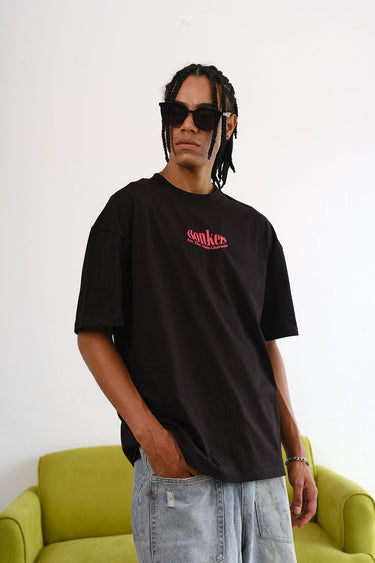 Black oversized T-shirt featuring a main character graphic by BonkersCorner, casual fit, displayed flat on a white background.