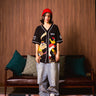 BonkersCorner Hit Man Tune Jersey in XS, featuring bold graphics and vibrant colors, designed for comfort and style.