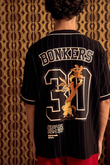 BonkersCorner Hit Man Tune Jersey in sizes XS, featuring vibrant design and sports-inspired style on a lightweight fabric.