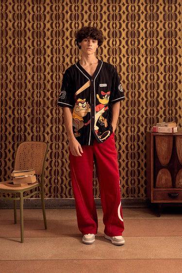 BonkersCorner Hit Man Tune jersey in XS size with vibrant colors and graphic design, ideal for sports and casual wear.