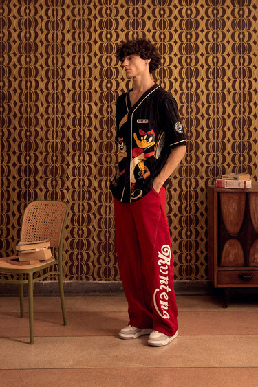 BonkersCorner XS Hit Man Tune Jersey featuring a vibrant design, ideal for sports or casual wear.